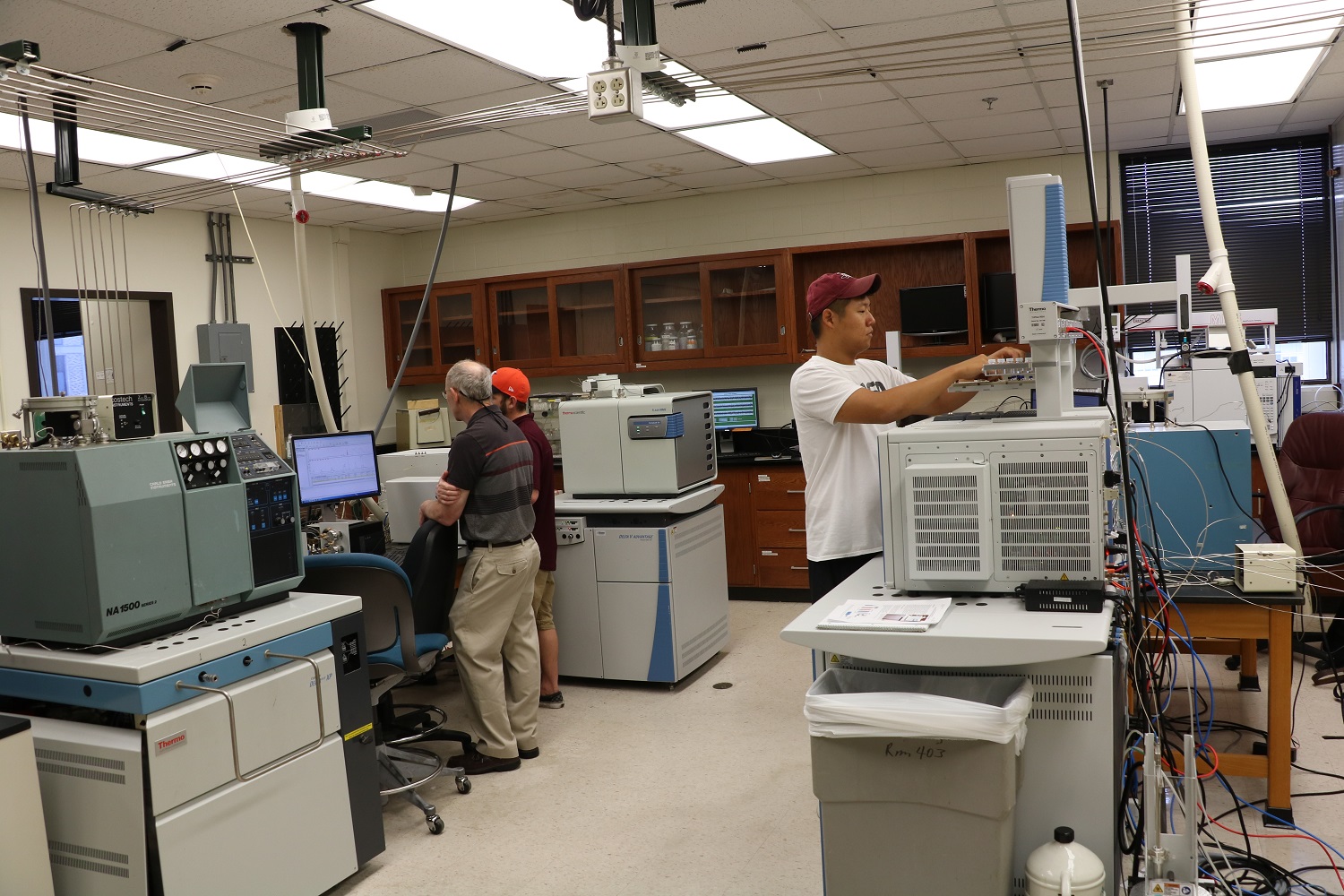 Professor and students in lab